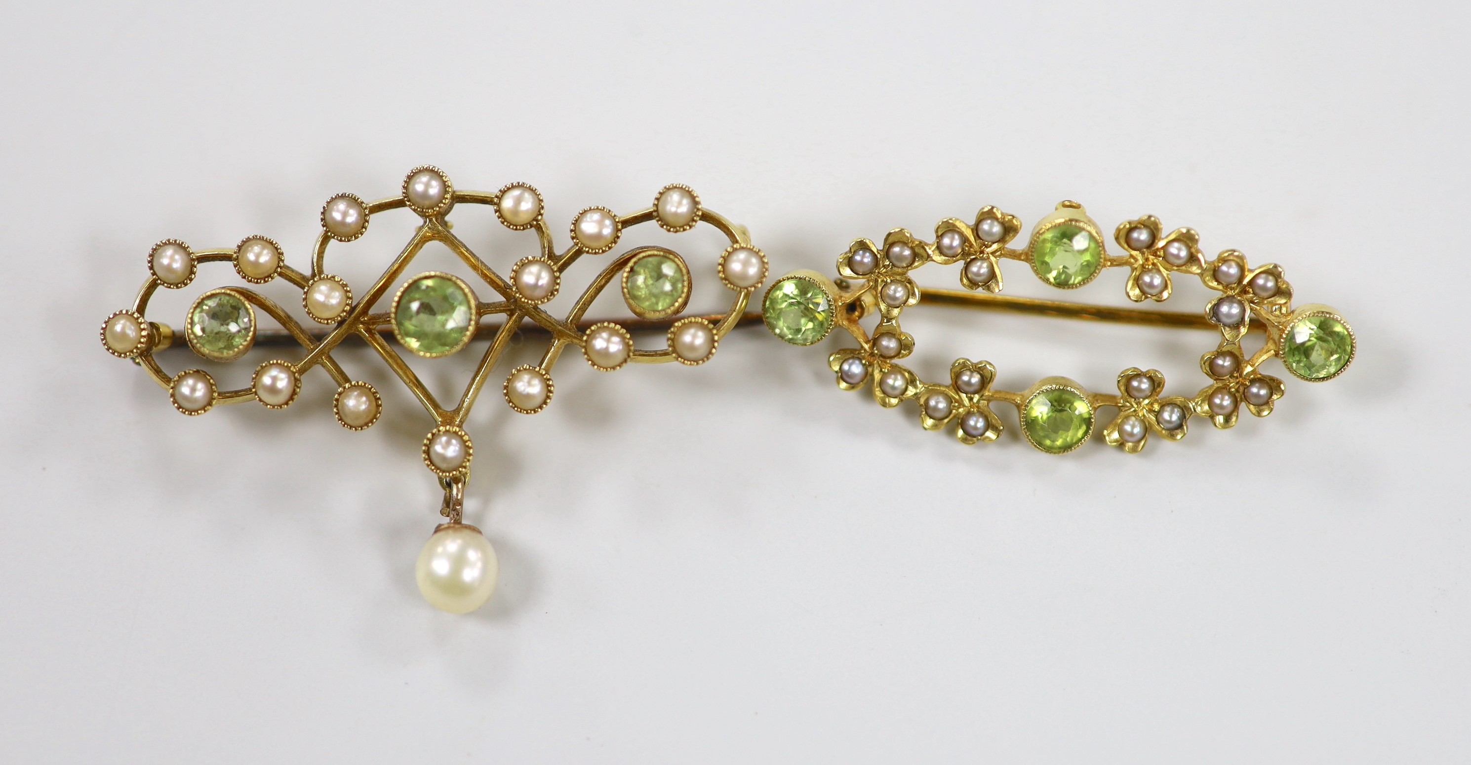 Two late Victorian 15ct, peridot and seed pearl set brooches, one with drop pearl, 41mm, gross weight 9.2 grams.